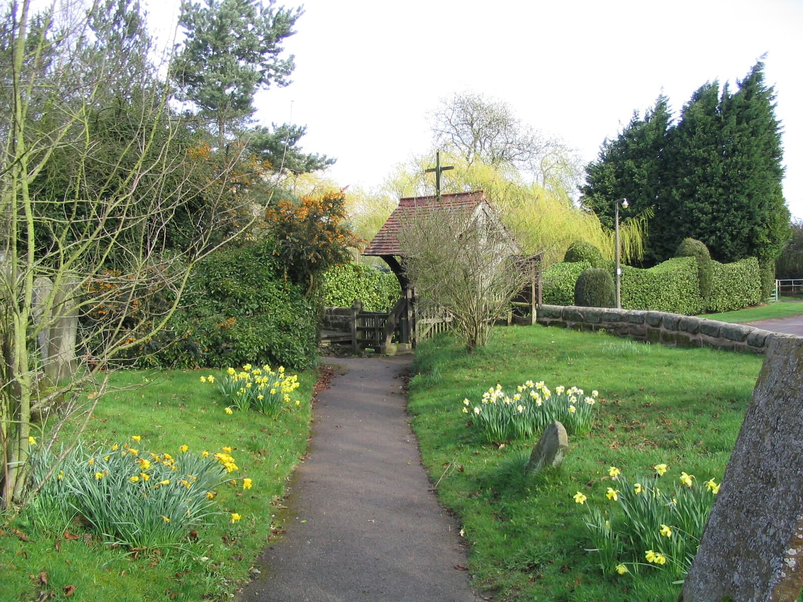 The path up to the lych gate, lined with daffodils in spring